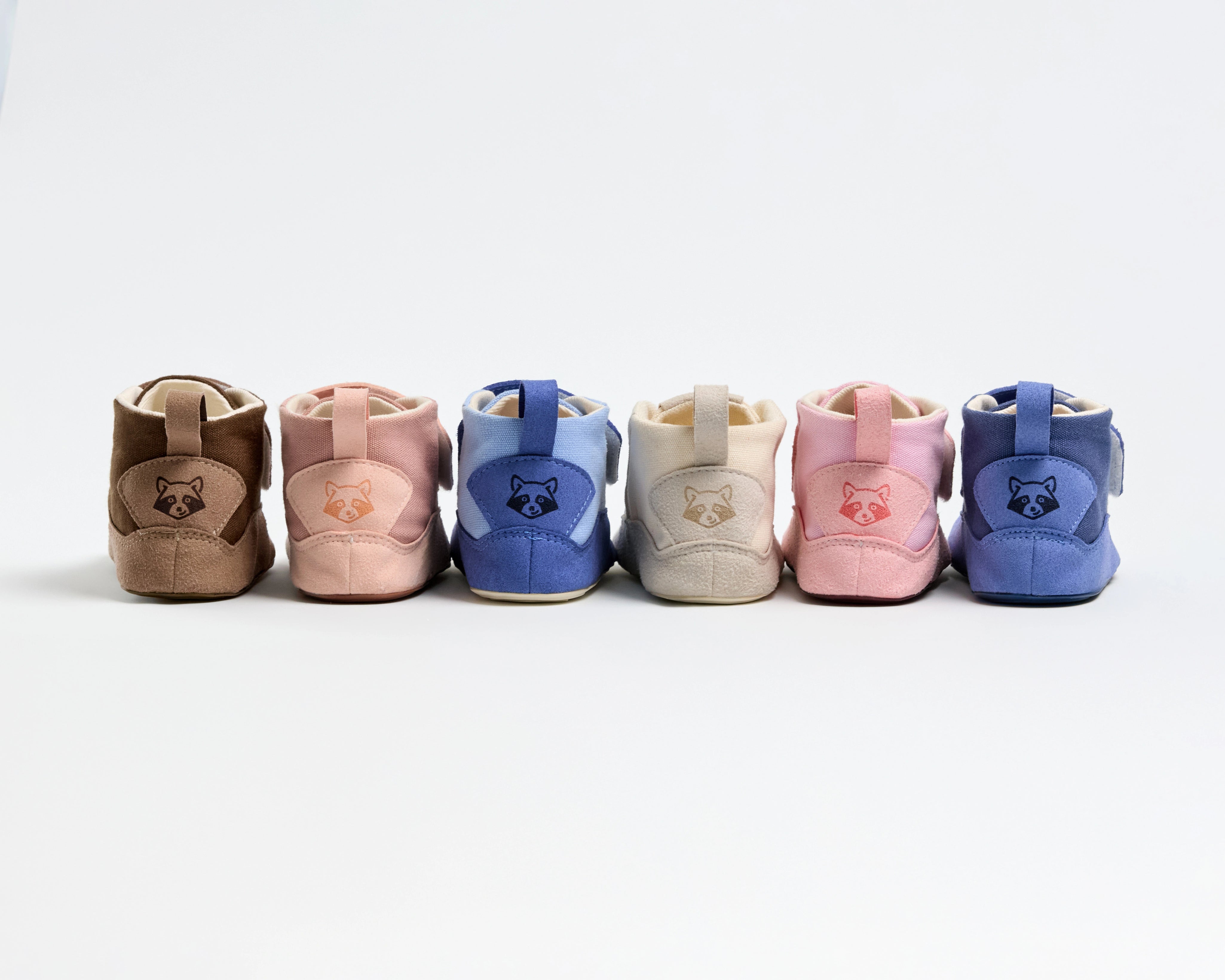 Boticas Gullibare para bebé en colores marrón, rosa, azul, beige y rosa claro. Calzado respetuoso hecho a mano con materiales naturales, diseñado para los primeros pasos.