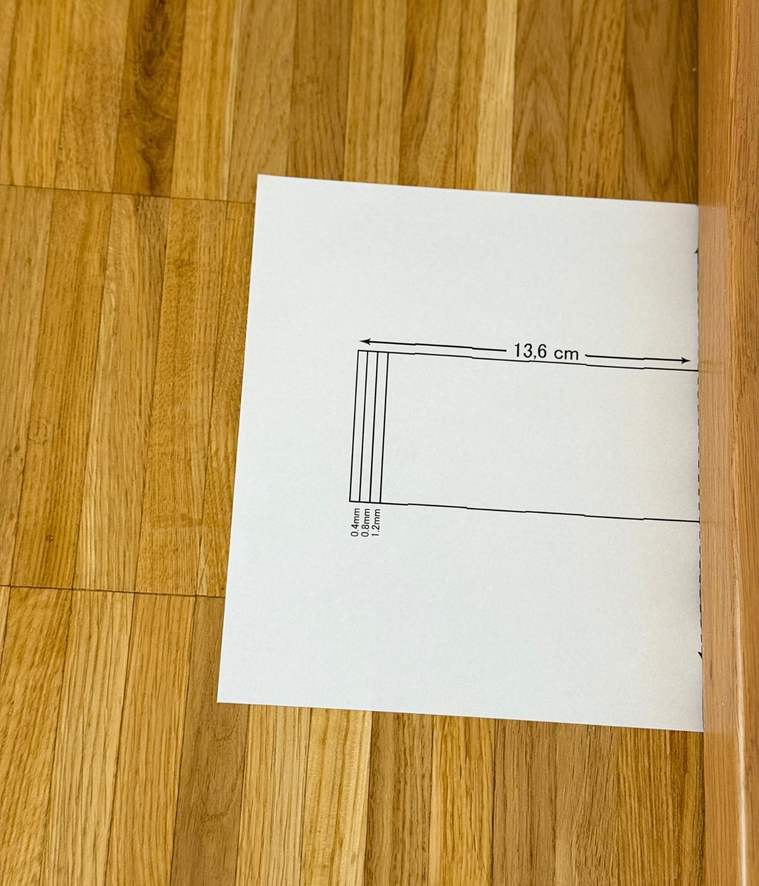 Plantilla de medición del pie infantil impresa con escala de referencia para elegir la talla correcta de boticas Gullibare.